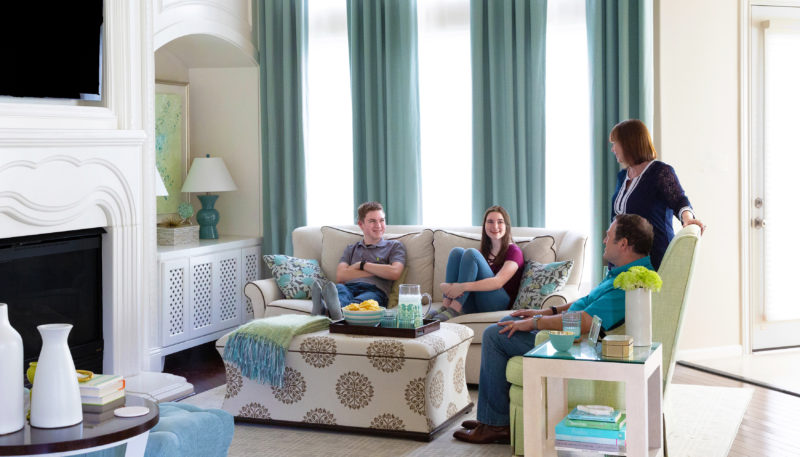 family in interior designed living room