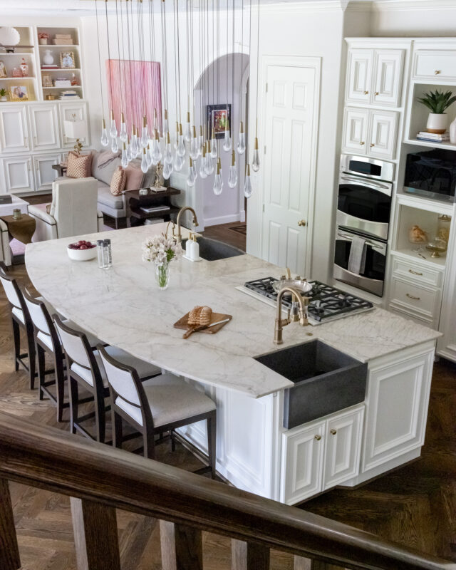 View of the redesigned kitchen from the stairs in a Memorial Park home