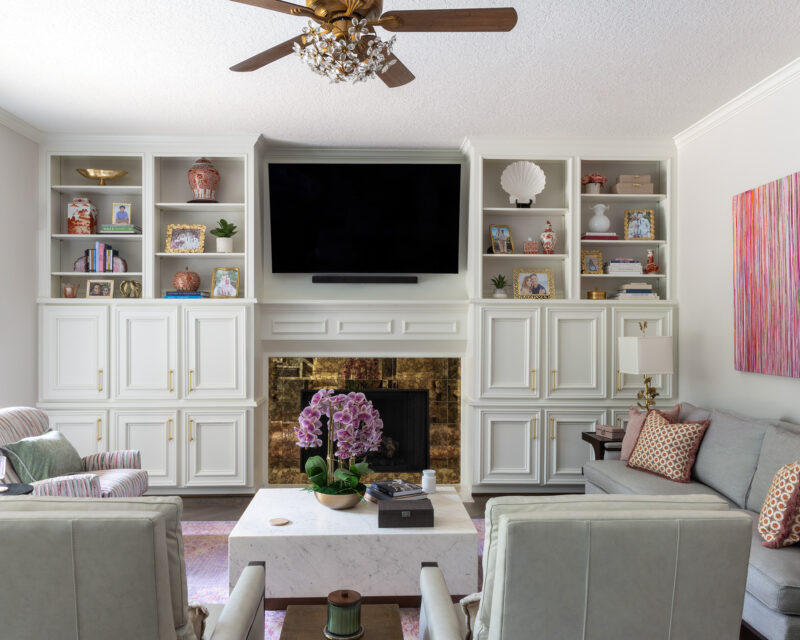 Living room with new furnishings and fireplace tile in a Memorial Park home, Houston